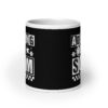 White ceramic mug featuring a black wraparound design with bold distressed white text reading ‘Adulting is a Scam.’ The text includes a smiley face, star, and flower icons, with a white checkerboard stripe along the bottom.