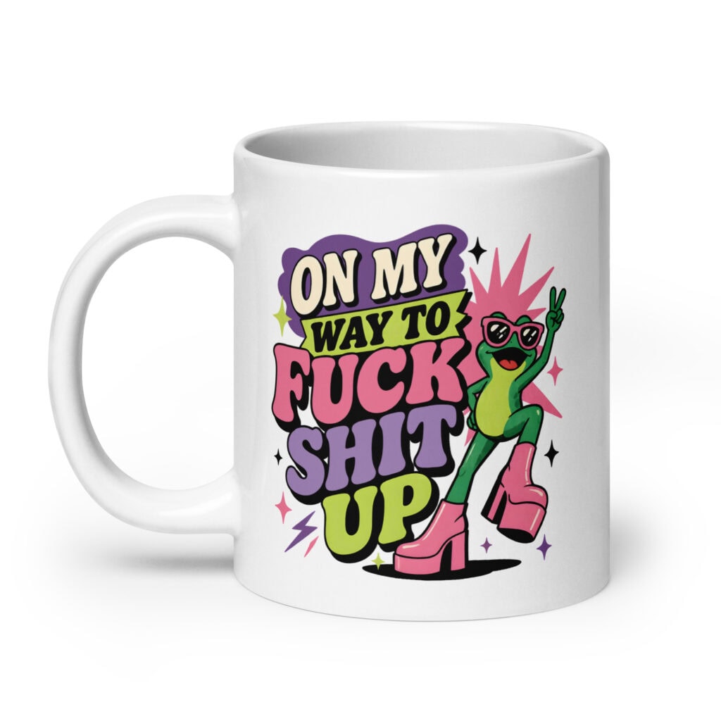 White mug with a retro frog and the phrase “On My Way to Fuck Shit Up.”