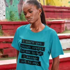 Woman making sad face wearing a tropical blue t-shirt with the text 'I don't get enough credit for the things I manage not to say' printed on the front.