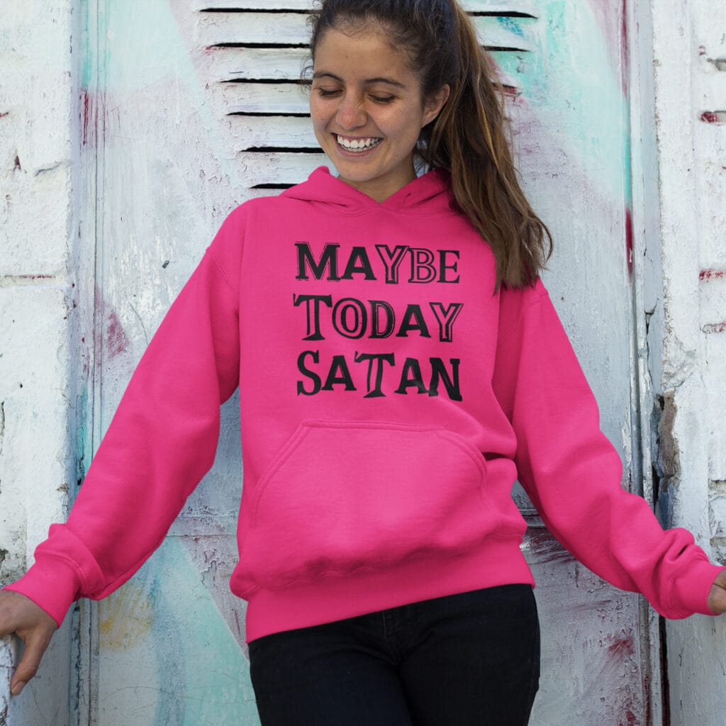 Woman wearing a heliconia pink hoodie sweatshirt with the text 'Maybe today Satan' printed on the front.