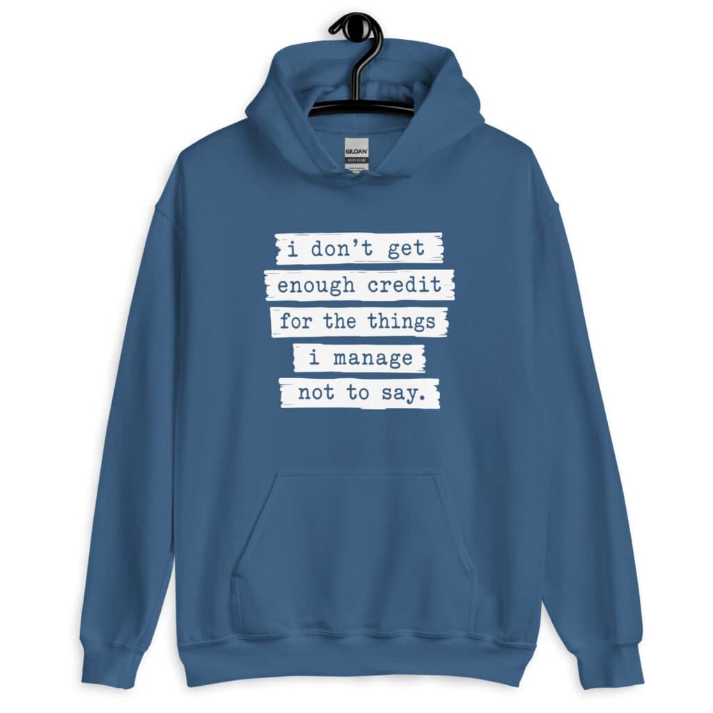 Indigo blue hoodie sweatshirt with the text 'I don't get enough credit for the things I manage not to say' printed on the front.