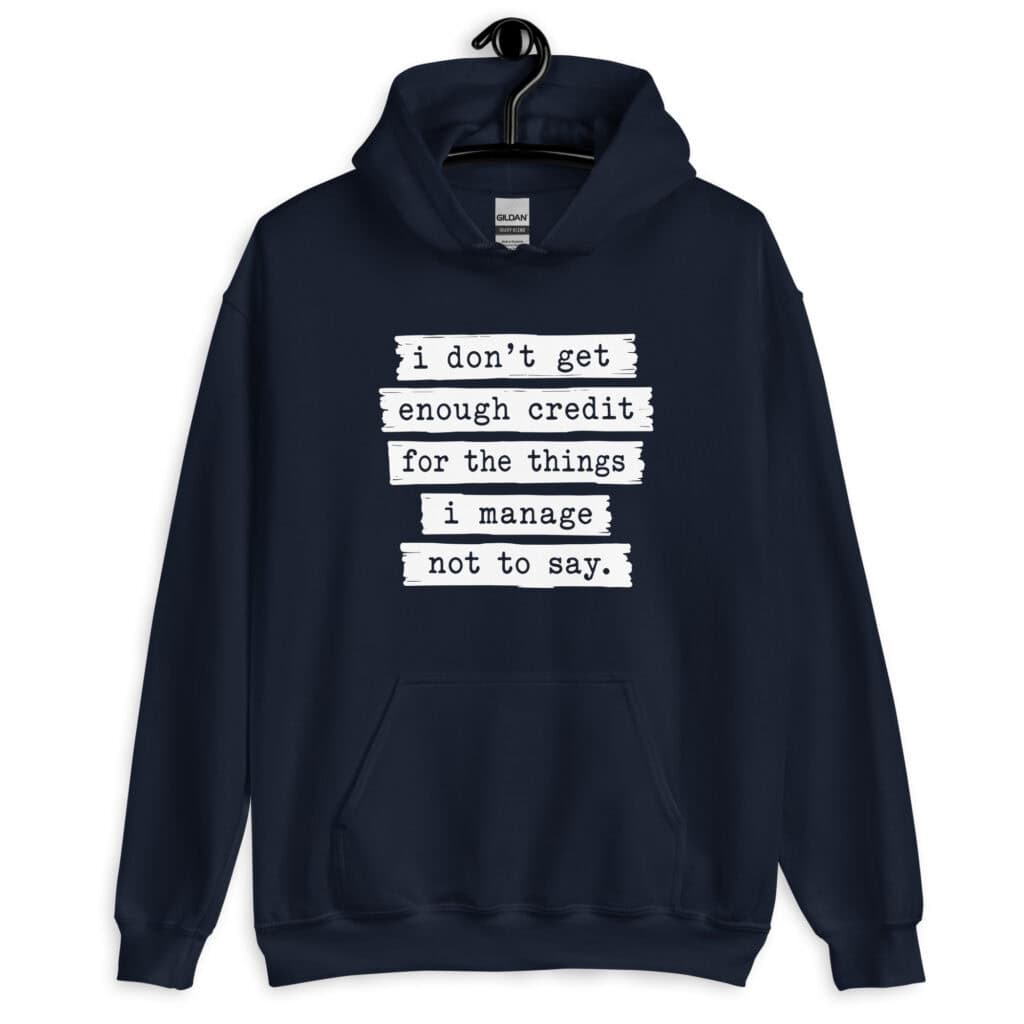 Navy blue hoodie sweatshirt with the text 'I don't get enough credit for the things I manage not to say' printed on the front.