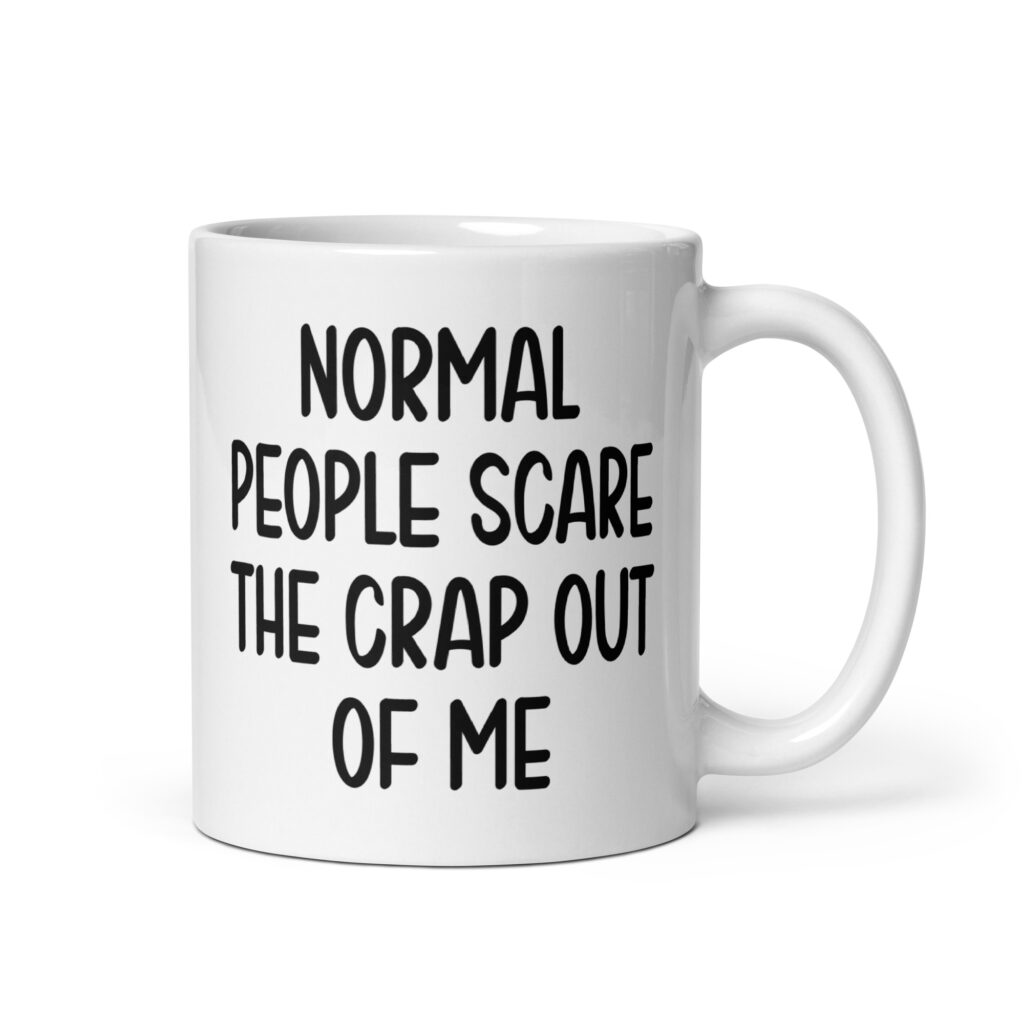 White ceramic mug with the text 'Normal people scare the crap out of me' printed on both sides.