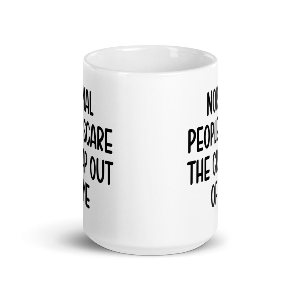 White ceramic mug with the text 'Normal people scare the crap out of me' printed on both sides.