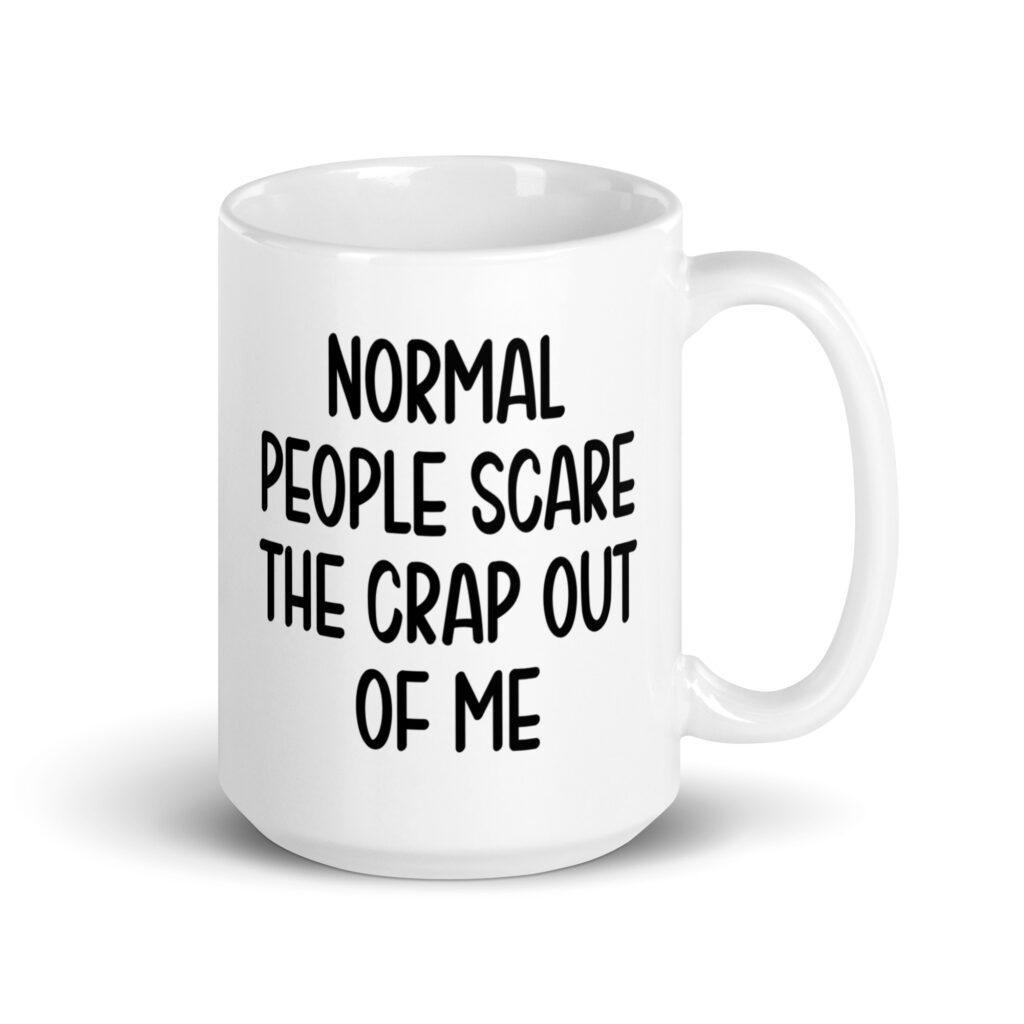 White ceramic mug with the text 'Normal people scare the crap out of me' printed on both sides.