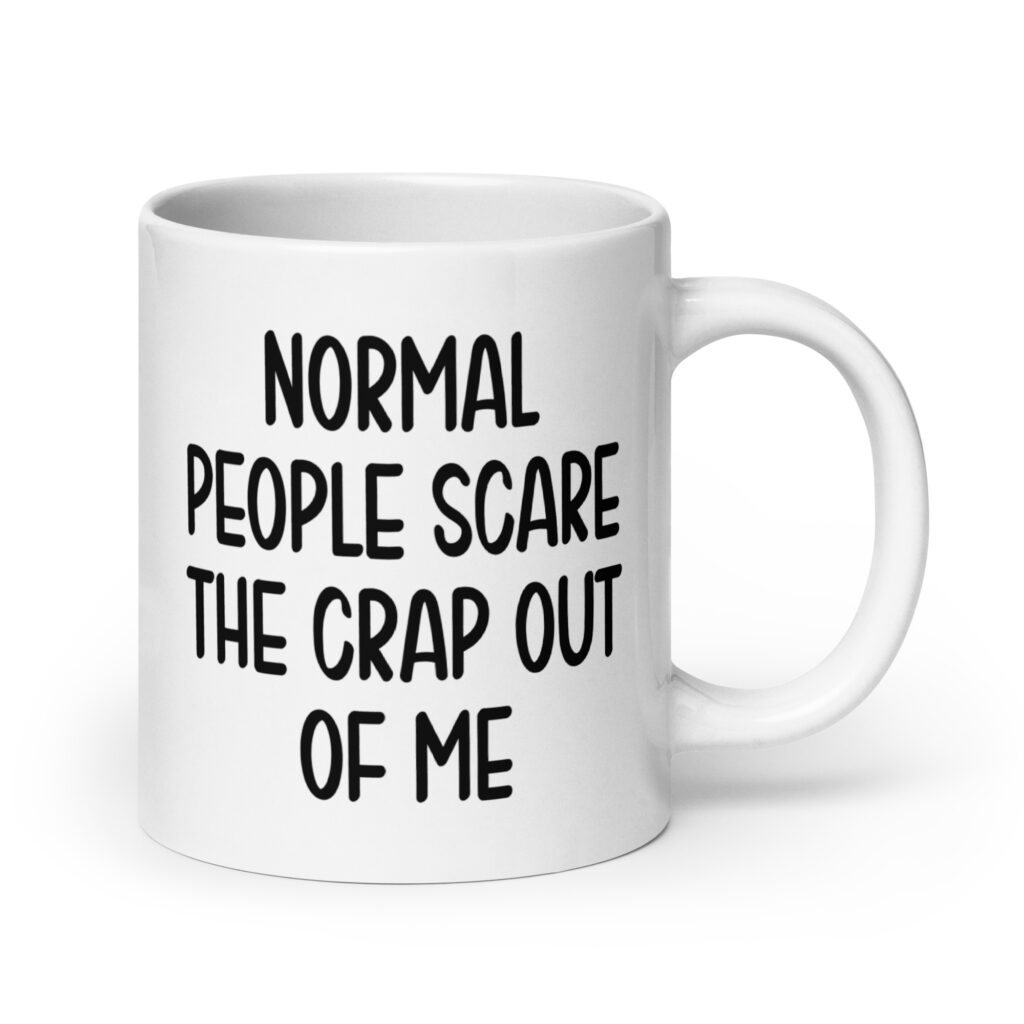White ceramic mug with the text 'Normal people scare the crap out of me' printed on both sides.