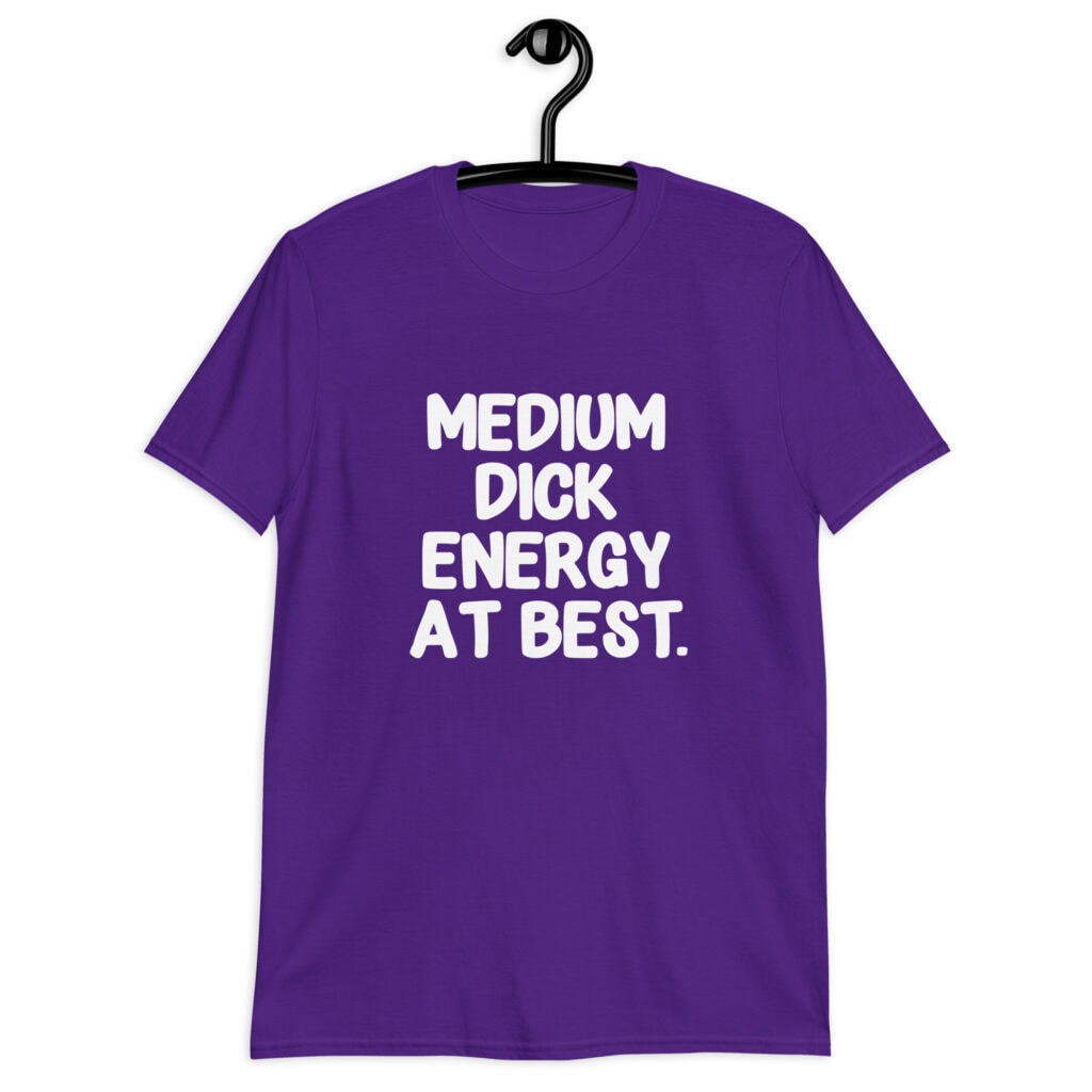 Purple t-shirt with the text 'MEDIUM DICK ENERGY AT BEST.' printed on the front.